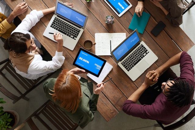 Photo by fauxels: https://www.pexels.com/photo/top-view-photo-of-group-of-people-using-macbook-while-discussing-3182773/